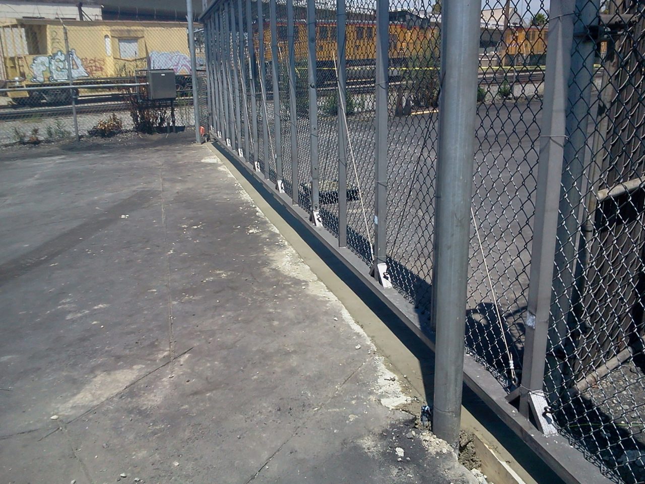 Vehicle slide gate installation