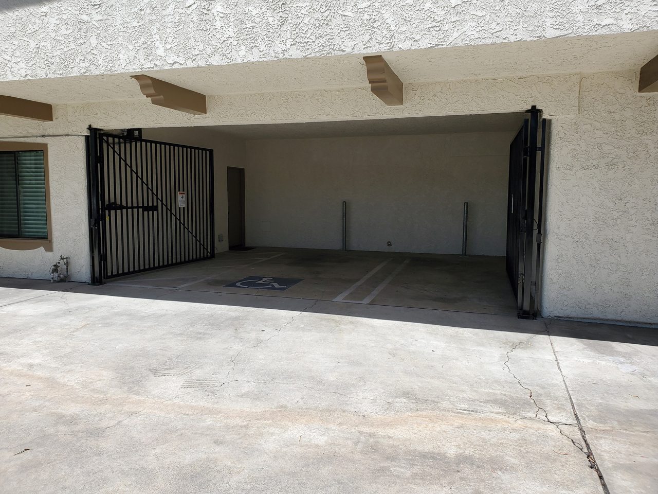 Vehicle swing gate installation