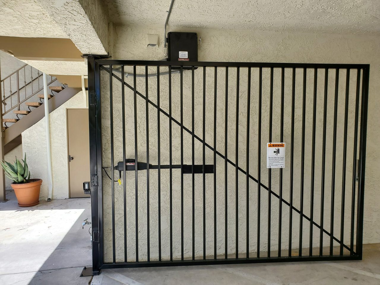 Vehicle swing gate installation